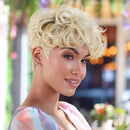 Woman with styled blonde hair in an outdoor setting, Obroi