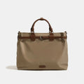 Beige tote bag with brown handles and accents on a white background, Obroi