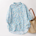Floral patterned shirt with a straw bag on a light background, Obroi
