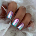 Hand with iridescent nail polish on a white feather background, Obroi
