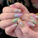 Close-up of hands with iridescent nail art on a blurred background, Obroi
