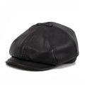 Black leather cap on a white background, Obroi