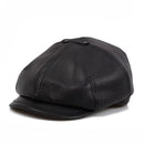 Black leather cap on a white background, Obroi