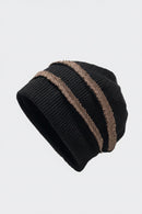 Black knit beanie with brown stripes on a light gray background, Obroi