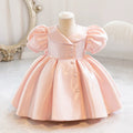 Pink dress on a mannequin against a white background, Obroi