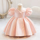 Pink dress on a mannequin against a white background, Obroi