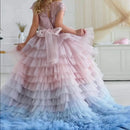 Pink and blue tiered dress with a bow detail on a white background, Obroi