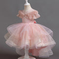 Pink glittery dress on a mannequin against a dark background, Obroi