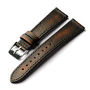 Brown leather watch strap with silver buckle on a white background, Obroi
