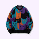Colorful sweater with cat pattern on a white background, featuring the brand 'Obroi'.