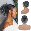 Woman with styled hair and mannequin head with gray braided wig, Obroi