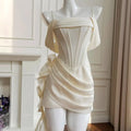 White dress on a mannequin against a neutral background, Obroi