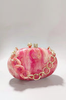 Pink marbled handbag with gold chain detail on a light gray background, Obroi