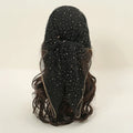 Black wig with star-like embellishments on a beige background, Obroi