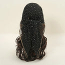 Black wig with star-like embellishments on a beige background, Obroi