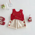 Red knitted top and beige shorts with strawberry patterns on a white background, Obroi