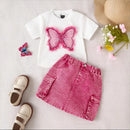 White t-shirt with pink butterfly design, pink denim skirt, sandals, and flowers on a light , Obroi