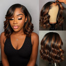 A wavy wig with dark brown and warm auburn highlights, shown on a model from the front and on a mannequin head from the back and side against a plain gray background, Obroi