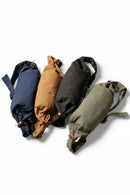 Four fabric bags in blue, brown, black, and green on a white background, Obroi