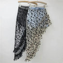 Two denim skirts with butterfly patterns on hangers against a white background, Obroi
