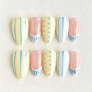 Set of handmade nails with pastel designs on a light background, Obroi