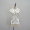 White short-sleeve t-shirt with black polka dots displayed on a cream dress form mannequin against a light gray background, Obroi