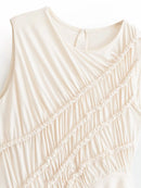 Close-up of a beige sleeveless top with textured pattern, Obroi