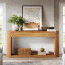 Wooden console table with decorative items against a neutral wall, Obroi
