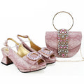 Pink high-heeled shoes with embellishments and a matching handbag on a white background, Obroi