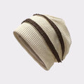 Beige knit beanie with a brown stripe on a light gray background, Obroi