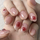 Close-up of a hand with pink glittery nail polish, Obroi