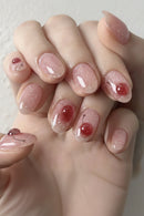 Close-up of a hand with pink glittery nail polish, Obroi