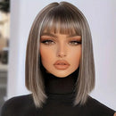 Person with a stylish haircut and makeup against a blurred background, Obroi
