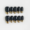 Set of black and gold nails on a white background, Obroi