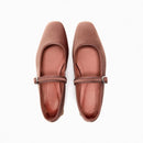 Pair of brown flat shoes with a strap on a white background, Obroi