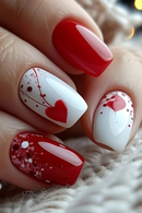 Nails with red and white design featuring a heart on a textured surface, Obroi