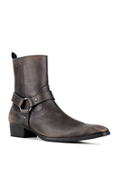 A dark brown distressed leather ankle boot with a buckle strap detail on the side, set against a plain white background, Obroi