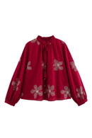Red blouse with floral patterns on a white background, Obroi
