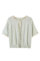 A pale sage green knit short-sleeve cardigan with cream lace trim and a front tie closure, displayed flat against a white background, Obroi