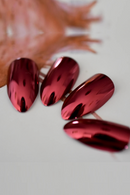 Set of red metallic nail art on a neutral background, Obroi