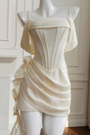 White strapless dress on a mannequin against a white wall, Obroi