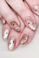 Nails with star-shaped designs on a light background, Obroi