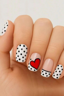 Nails with polka dot and heart design on a light background, Obroi