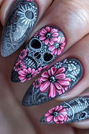 Nails with black skull and pink flower design on a neutral background, Obroi