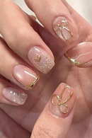 Close-up of hands with pink and gold nail design, Obroi