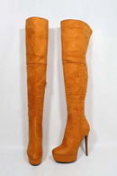 Pair of orange suede knee-high boots on a white background, Obroi
