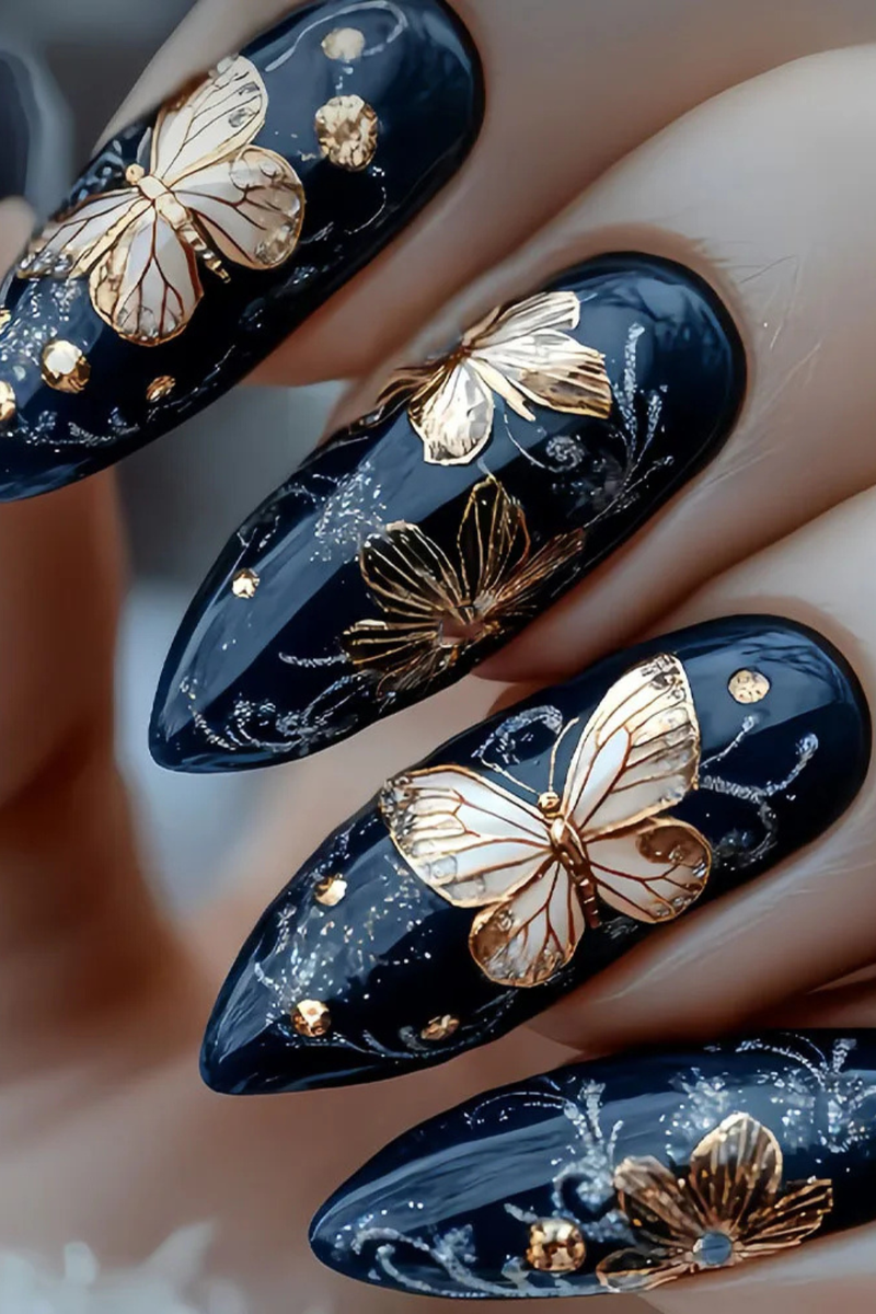 Nails with black and gold butterfly design