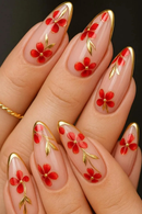 Nails with red floral design and gold accents on a dark background, Obroi