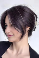 Woman with styled hair featuring hair extensions on a white background, Obroi