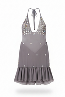 A gray halter-neck dress with a deep V-neckline, decorated with rhinestone embellishments on the bust and scattered down the front, featuring a ruffled hem, Obroi